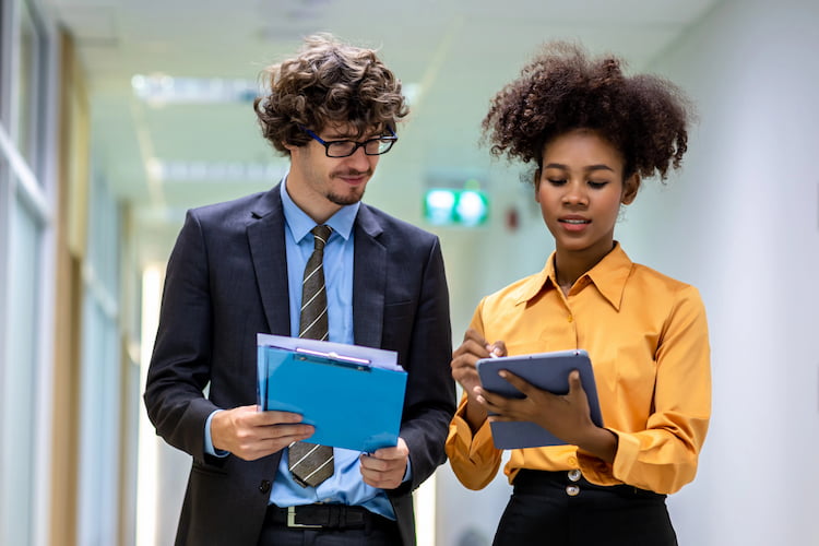 Two researchers working on a project together and collaboratively. 